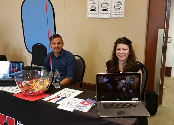 Eric Haskell, left, and Calli Peterson staff the UIT table at the event.