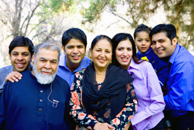 L-R: Amir's brother Sana, father Masood, brother Umair, mother Zeenat, wife Kinza, son Ashar, and Amir. Not pictured: sister Imrana and brother Asim.