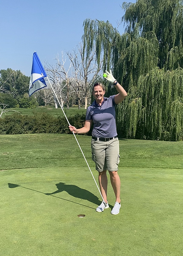 Sharia Mindrum celebrates her hole-in-one on hole No. 8 at Forest Dale Golf Course.