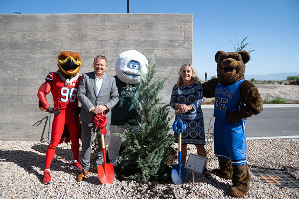 L-R: U mascot Swoop, U President Taylor Randall, the Herriman Yeti, SLCC President Deneese Huftalin, and SLCC mascot Brutus plant a Juniper tree during a ribbon-joining ceremony on August 7 at the Juniper Building. Image courtesy of the University of Utah. L-R: U mascot Swoop, U President Taylor Randall, the Herriman Yeti, SLCC President Deneese Huftalin, and SLCC mascot Brutus plant a Juniper tree during a ribbon-joining ceremony on August 7 at the Juniper Building. Image courtesy of the University of Utah.