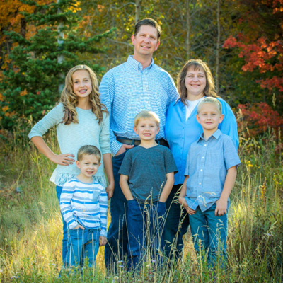 Roy Schulz (center back), manager, UMail & Collaboration, with his family.