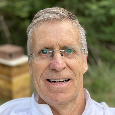 James Harris, shown here with some of his hives, has been a beekeeeper since 2021 (Courtesy of James Harris)