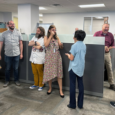 DCIO staff play Rock, Paper, Scissors.