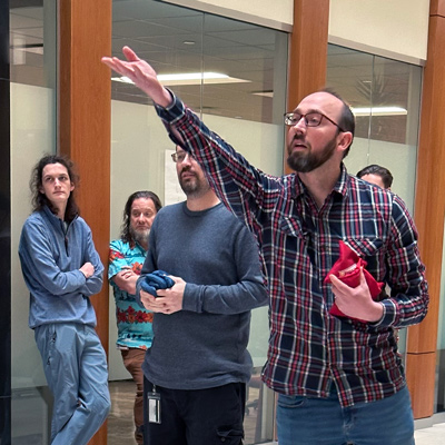 Dan Gillen tosses a bag during the DCIO cornhole tournament on January 13, 2025.