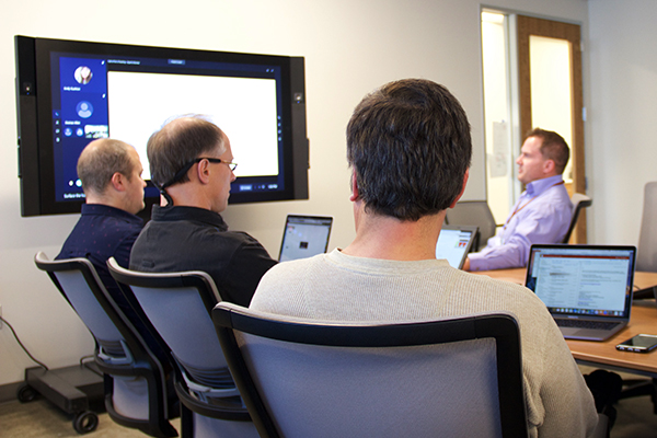 Clayton Barlow, right background, ITS Associate Director for Enterprise Architecture
